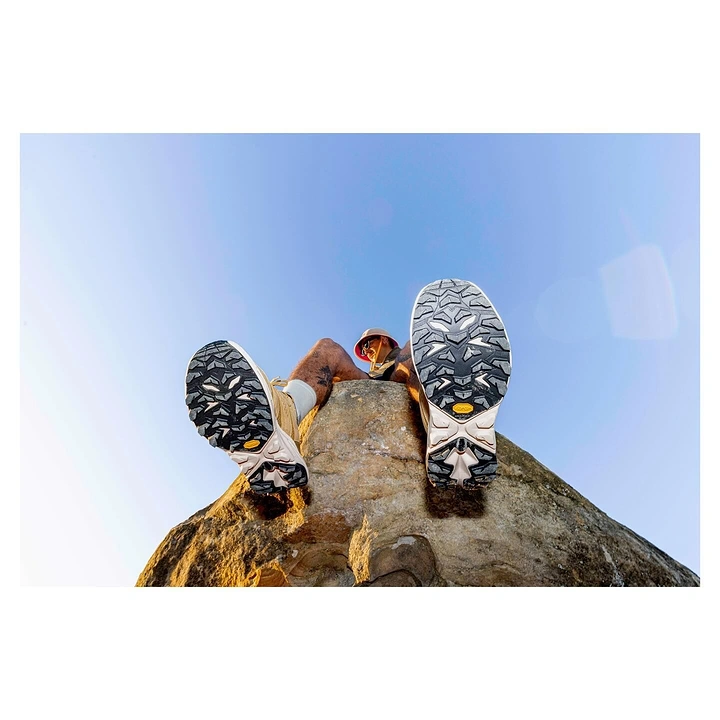 Adventure Sports & Trekking creative ad: Unexpected soles-first climbing perspective
