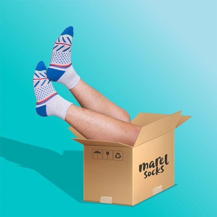Socks Brands creative ad: Socks comically emerge from shipping box