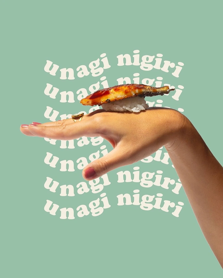 Sushi & Japanese Restaurants creative ad: Hand-held sushi typography composition
