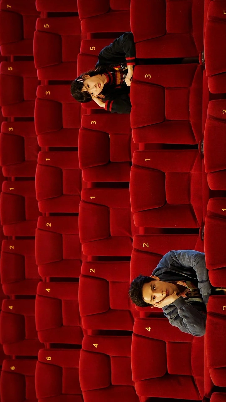 Cinemas & Movie Theatres creative ad: Actors lying across red cinema seats