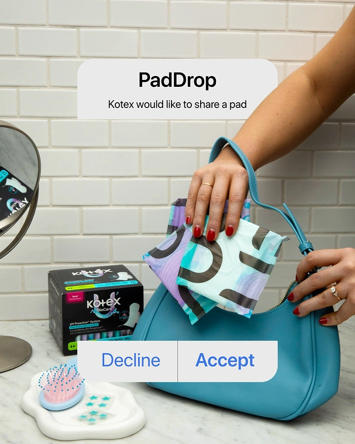 Period Care & Feminine Hygiene creative ad: Hand slipping wrapped pads into a teal handbag