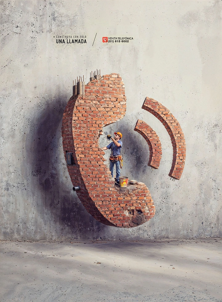Construction creative ad: Brick-built phone handset with a mason working inside it