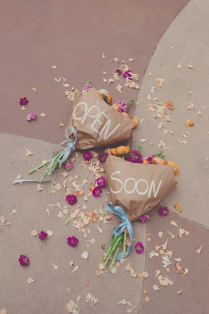 Florists creative ad: Kraft-wrapped bouquets spell 'Open Soon'