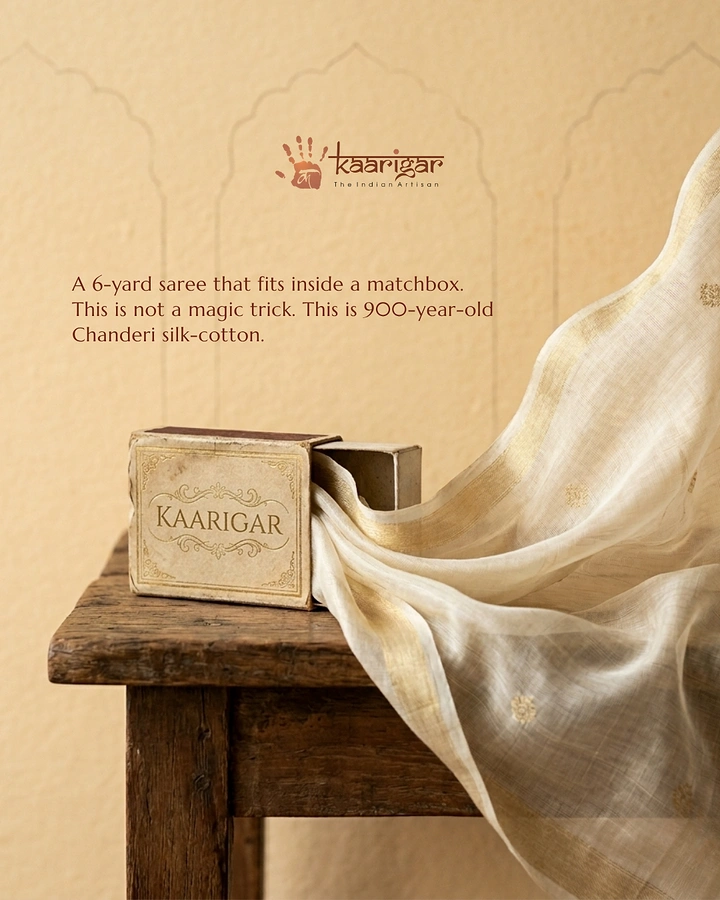 Textiles & Fabrics creative ad: Sheer Chanderi saree flowing from a vintage matchbox