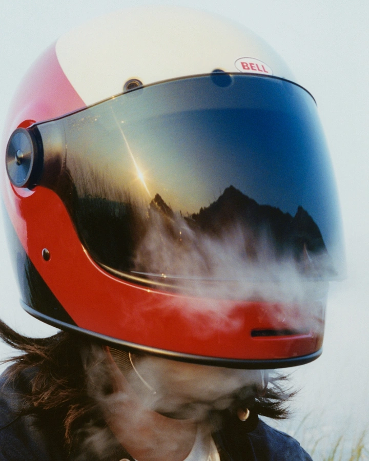 Helmets & Riding Gear creative ad: Visor reflection creates cinematic landscape metaphor