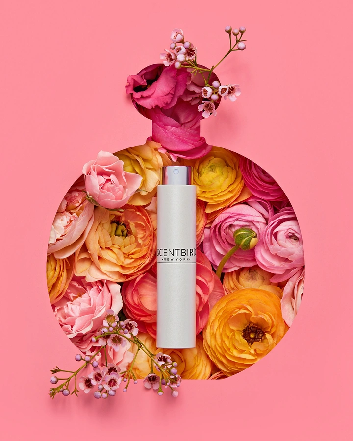 Creative ad: Spray atomizer inside a flower-filled bottle-shaped cutout