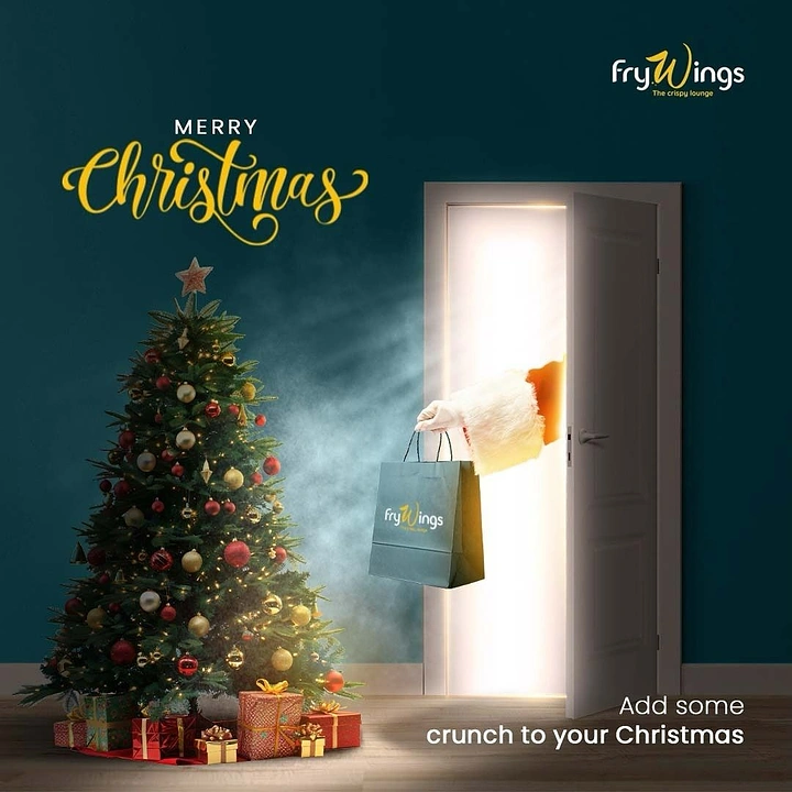 Christmas creative ad: Santa's arm handing a branded takeaway bag through a glowing door beside a decorated Christmas tree