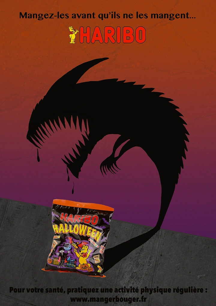 Halloween creative ad: Halloween candy bag casting a giant fanged monster shadow