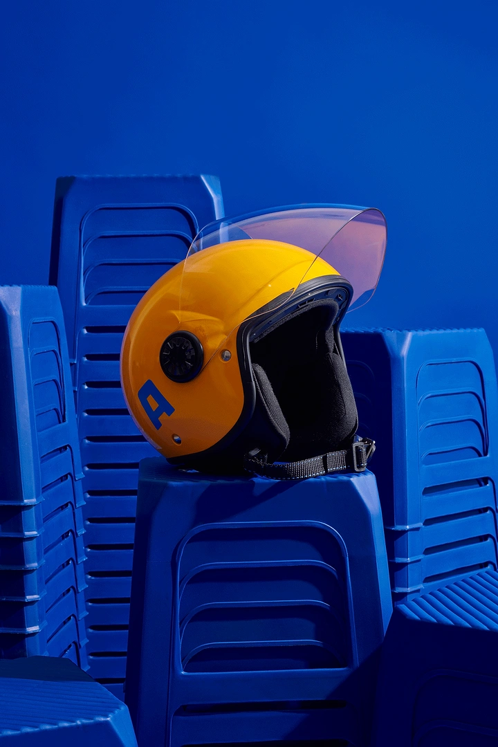 Helmets & Riding Gear creative ad: Unexpected sculptural helmet display composition
