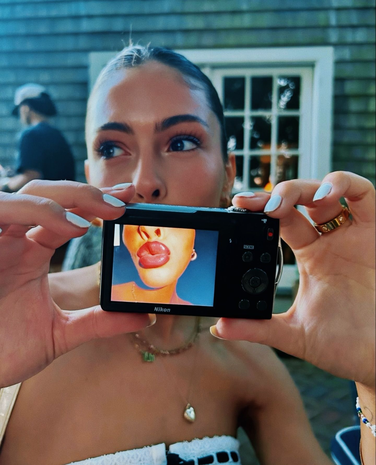 Instagram post: Camera styled as high-fashion accessory, slide 2