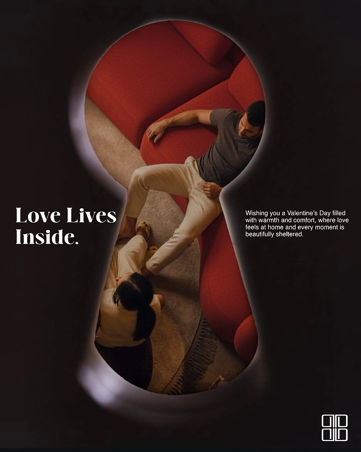 Valentine's Day creative ad: Couple relaxing by a red sofa seen through a keyhole