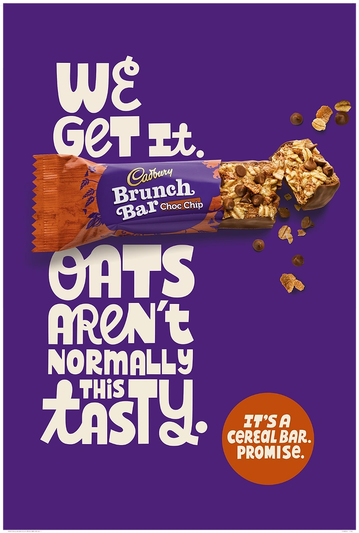 Creative ad: Half-unwrapped choc chip cereal bar with crumbs flying off