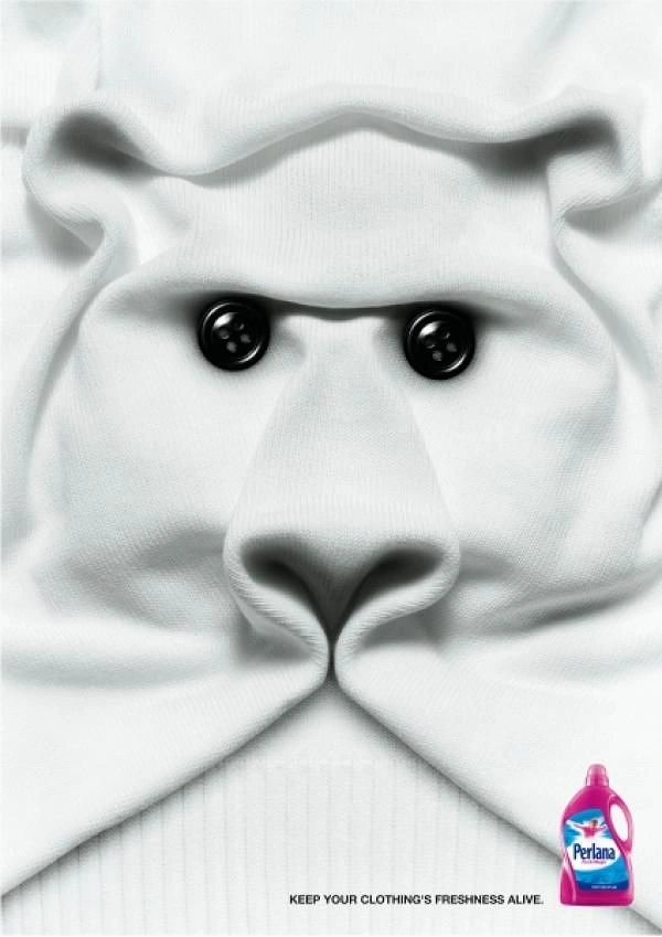 Detergents & Home Cleaning Products creative ad: White knit sweater folded into a polar bear face with button eyes