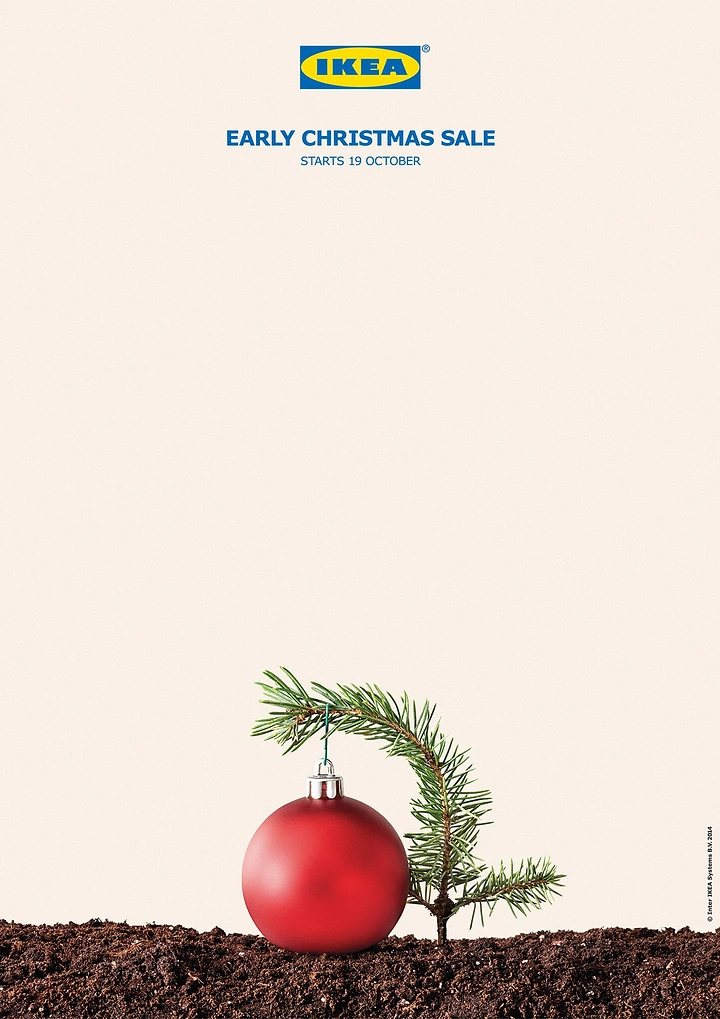 Furniture creative ad: Red bauble weighing down a tiny fir sapling growing from soil