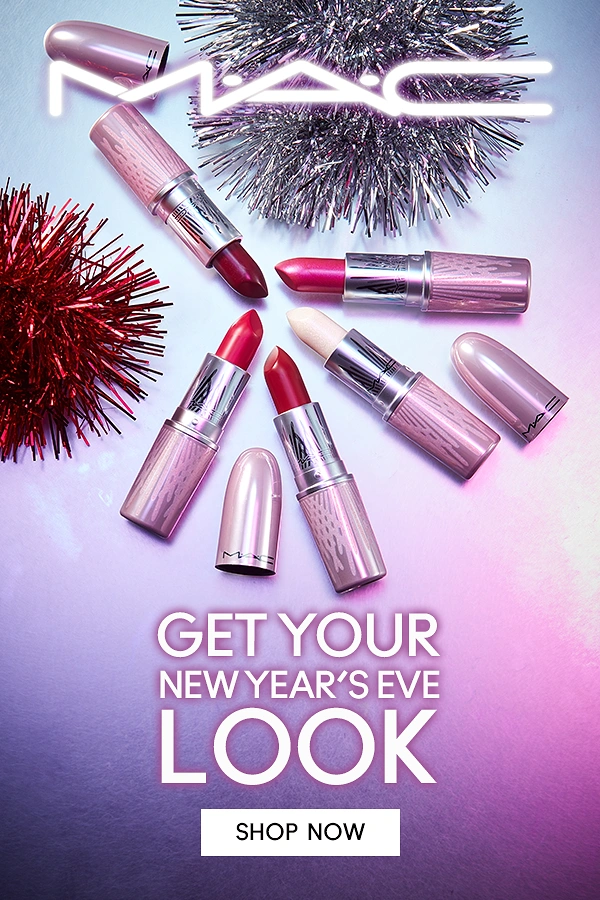 New Year creative ad: Fanned flat-lay of pink metallic lipsticks with tinsel