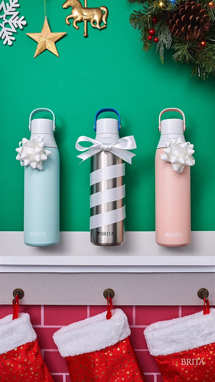 Christmas creative ad: Three filter water bottles with gift bows on a mantel