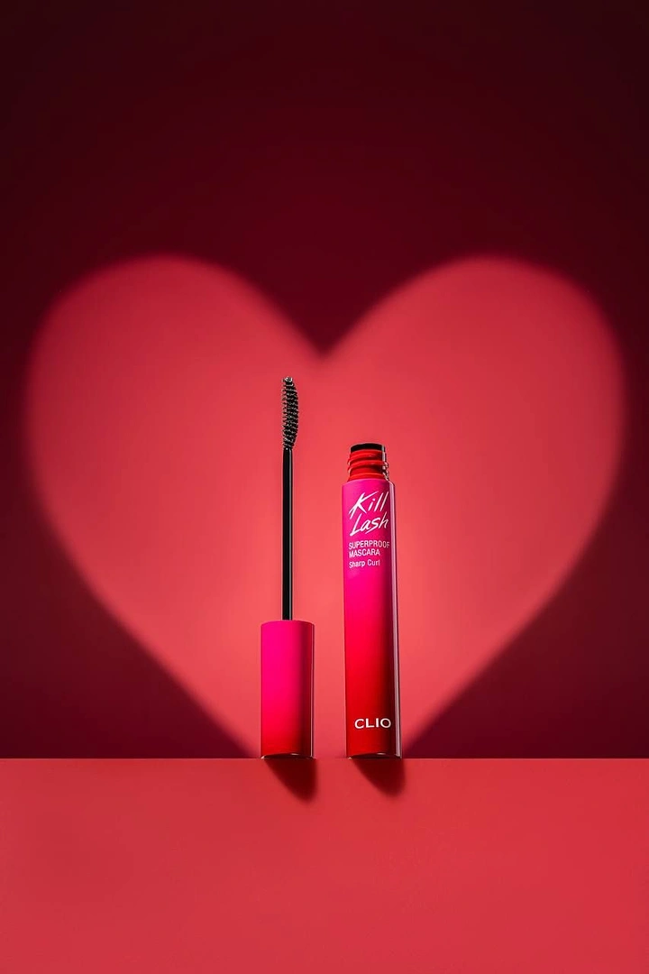 Valentine's Day creative ad: Mascara tube and wand under a heart-shaped light