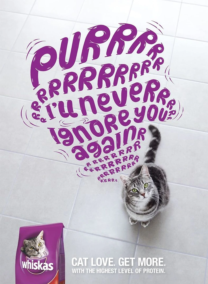 Pets creative ad: Tabby cat looking up with swirling purple purr typography above it