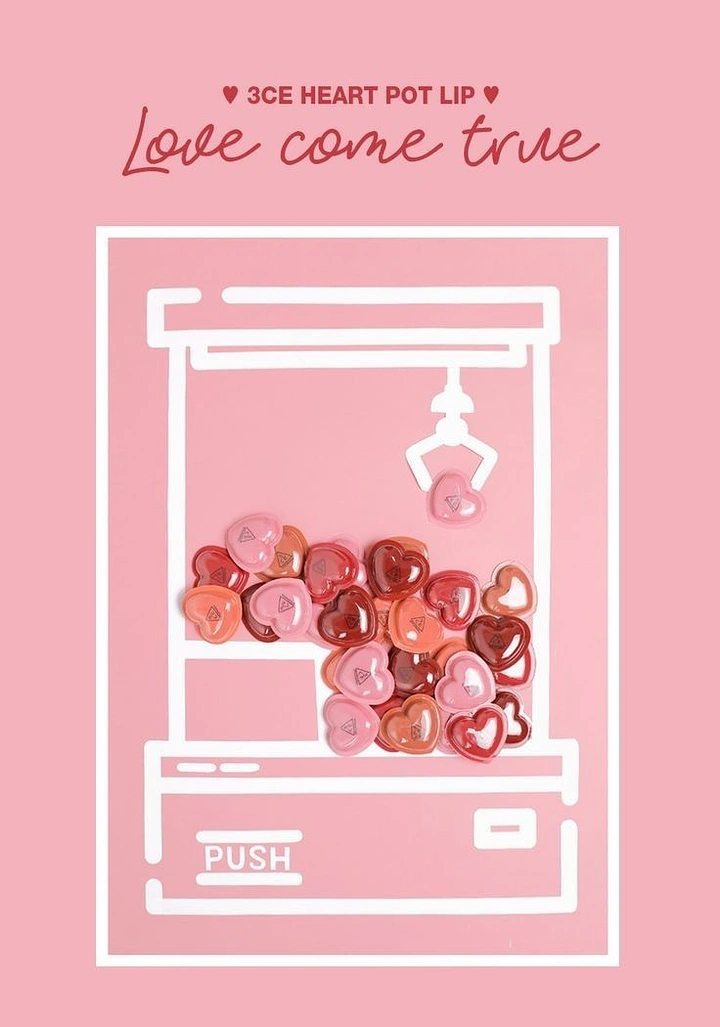 Valentine's Day creative ad: Heart-shaped lip pots heaped inside a white line-drawn claw machine
