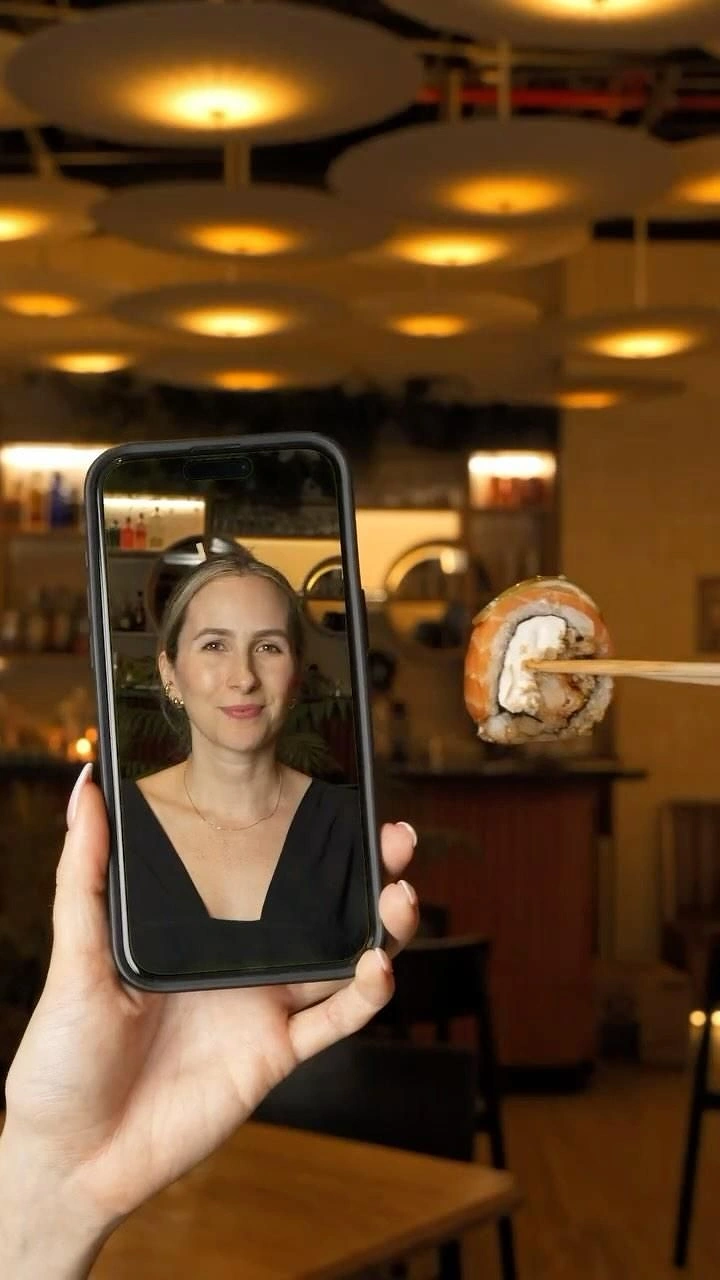 Sushi & Japanese Restaurants creative ad: Phone screen mirrors restaurant sushi experience