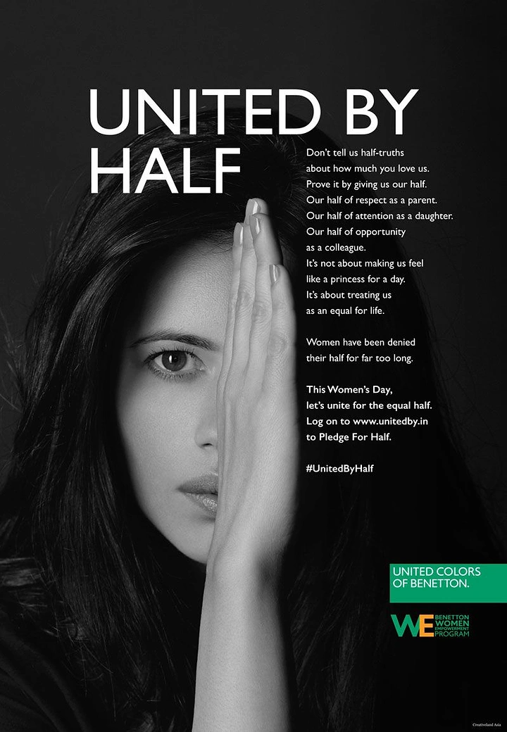 Women's Day creative ad: Black and white portrait of a woman covering half her face with her hand