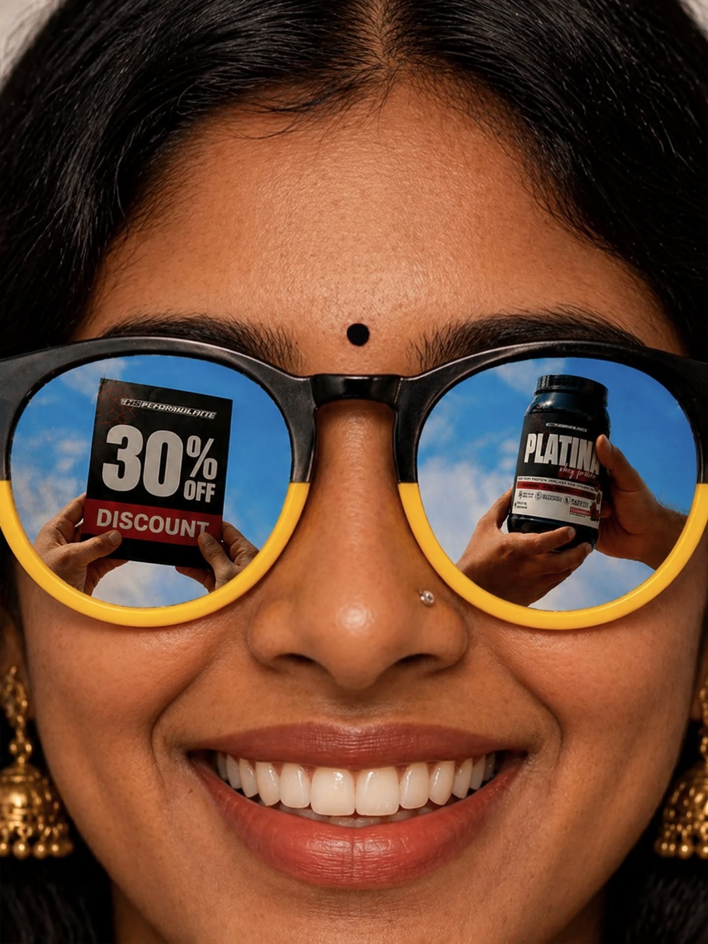 Carousel: Extreme close-up of a woman whose sunglass lens reflects hands holding a protein tub, slide 2
