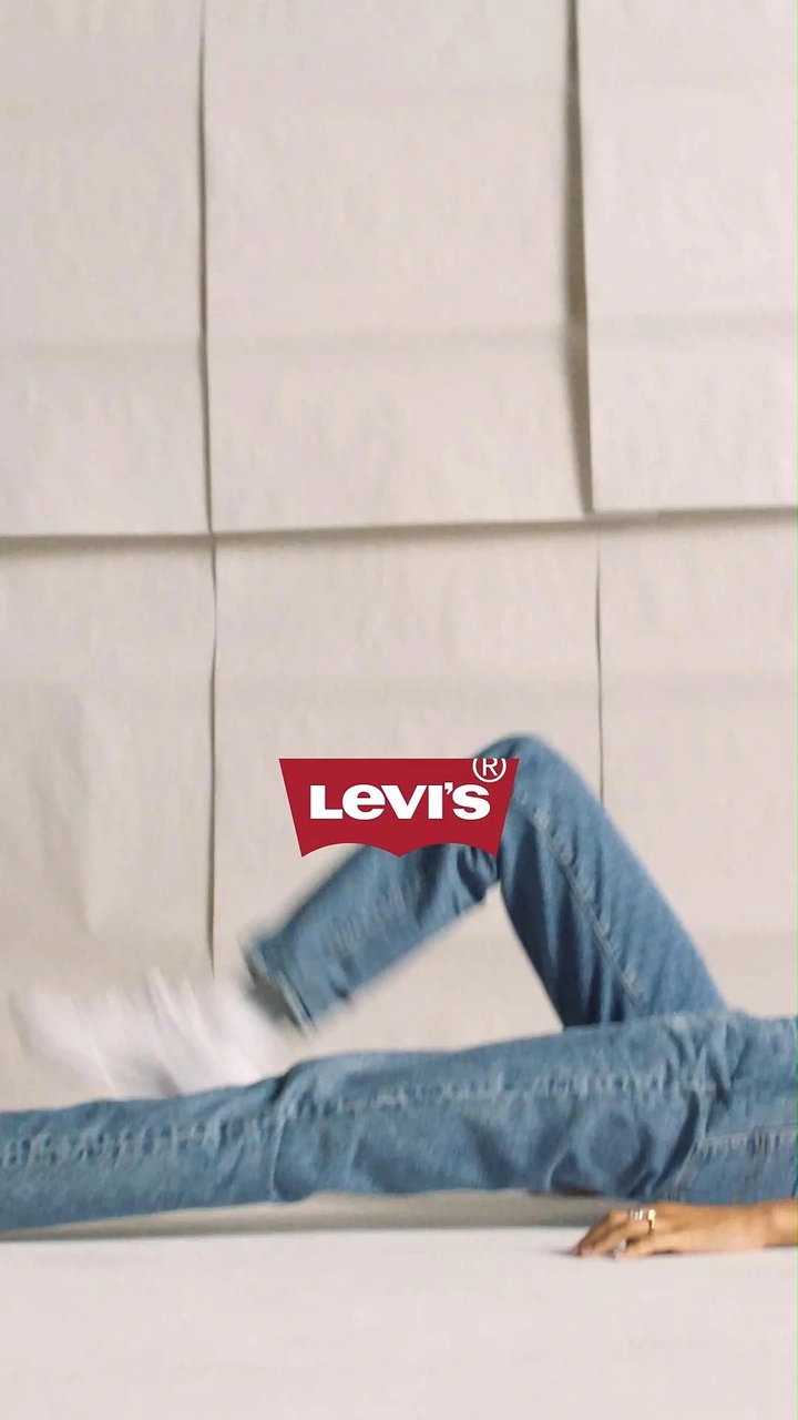 Denim & Jeans Brands creative ad: Surreal Levi's legs-through-sheets composition