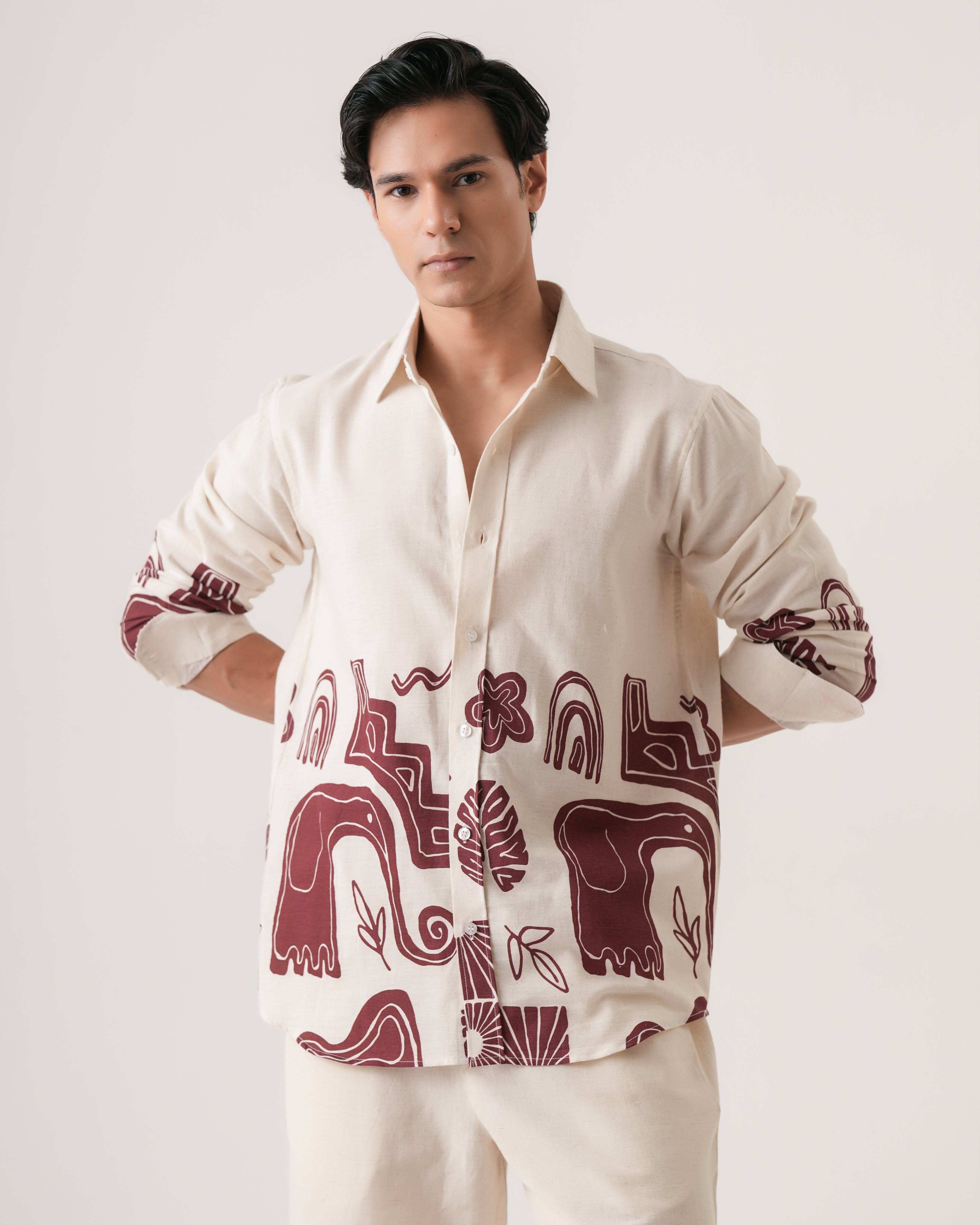 Carousel: Three folded printed shirts forming a winning tic-tac-toe line, slide 3