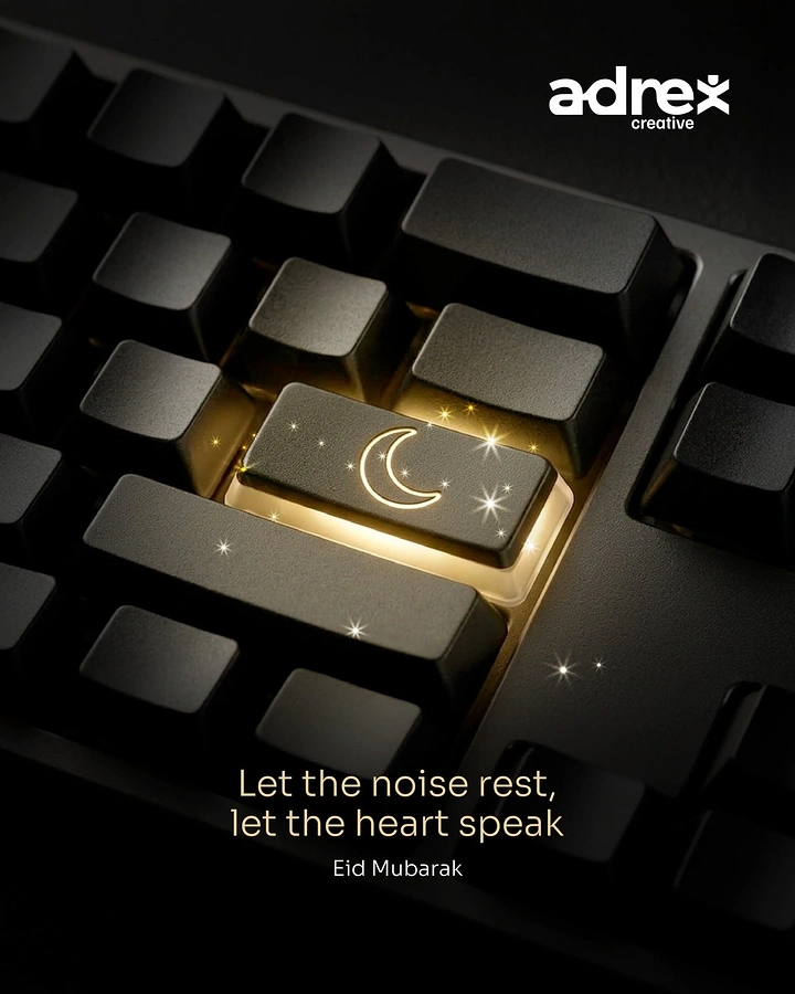 Eid creative ad: Glowing keyboard key engraved with a crescent moon