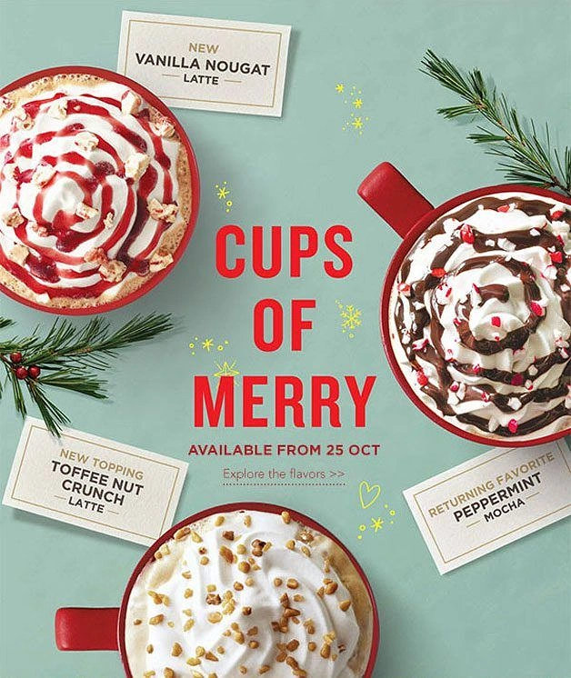 Christmas creative ad: Overhead view of three holiday lattes in red mugs