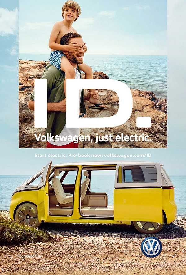 Electric Vehicles creative ad: Father carrying son on shoulders above a yellow electric concept van by the sea