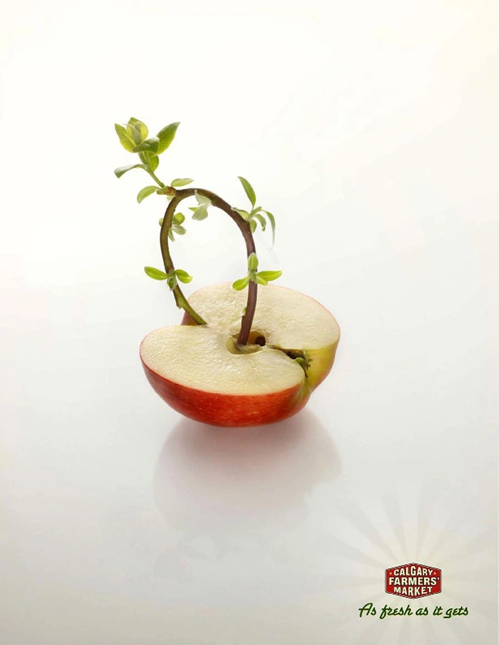 Agriculture, Seeds & Fertilizers creative ad: Halved red apple with a seedling sprouting from its core