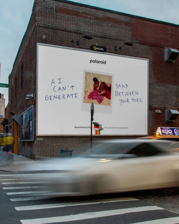 Photography creative ad: Polaroid billboard: witty 'AI can't generate' copy