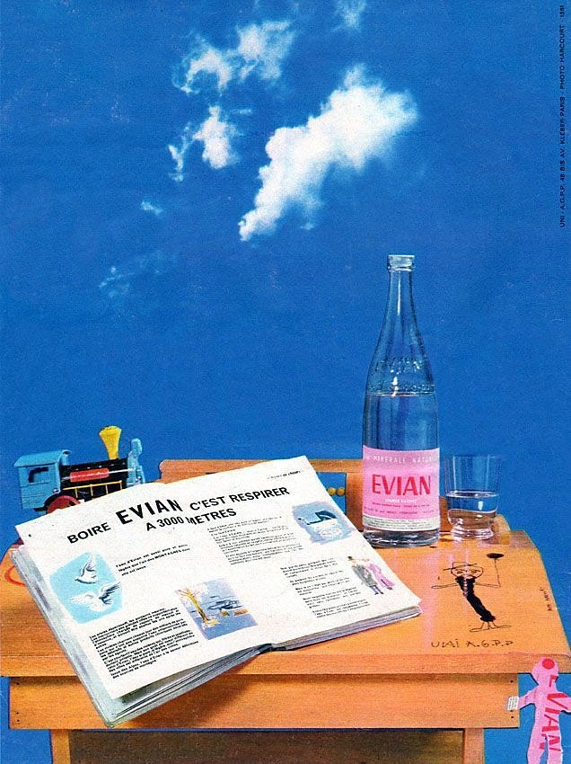 Packaged Drinking Water creative ad: Evian bottle staged with newspaper