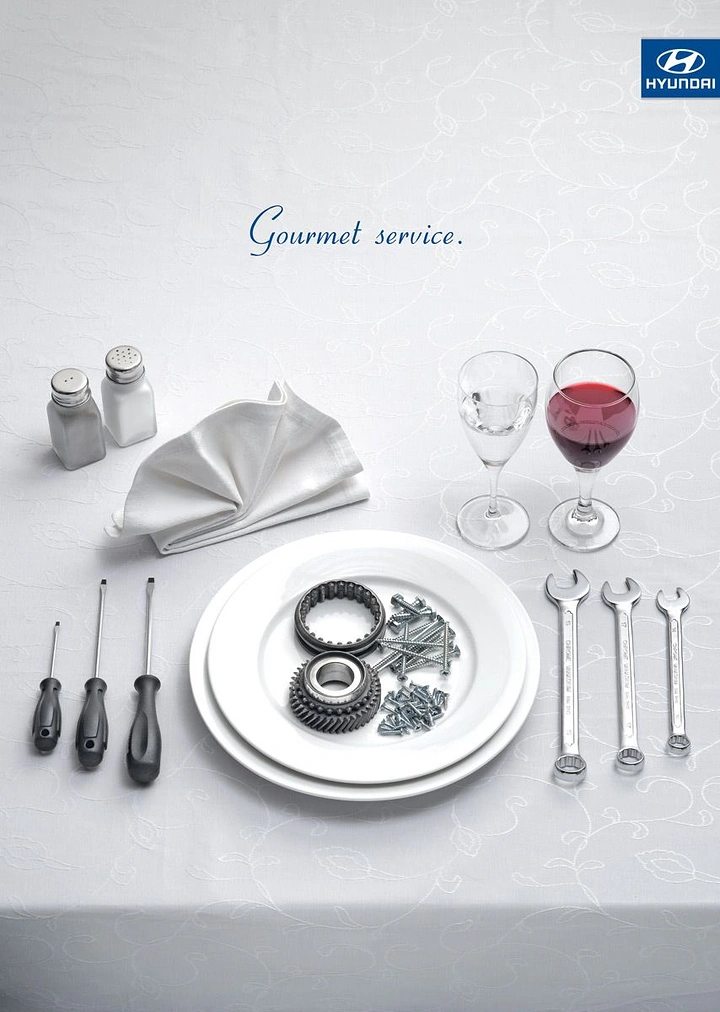 Auto Repair & Garages creative ad: Car parts as gourmet dinner setting