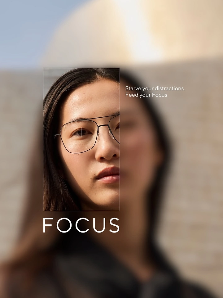 Creative ad: Woman in thin wire eyeglasses, sharp crop window over blurred portrait