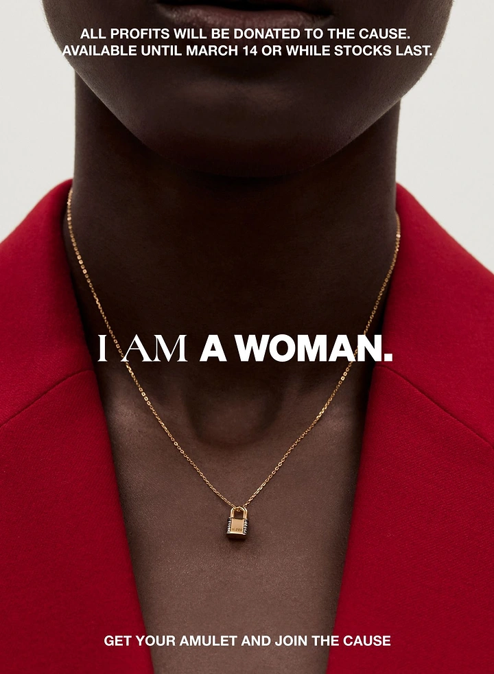 Women's Day creative ad: Close crop of a woman's neck wearing a gold padlock pendant