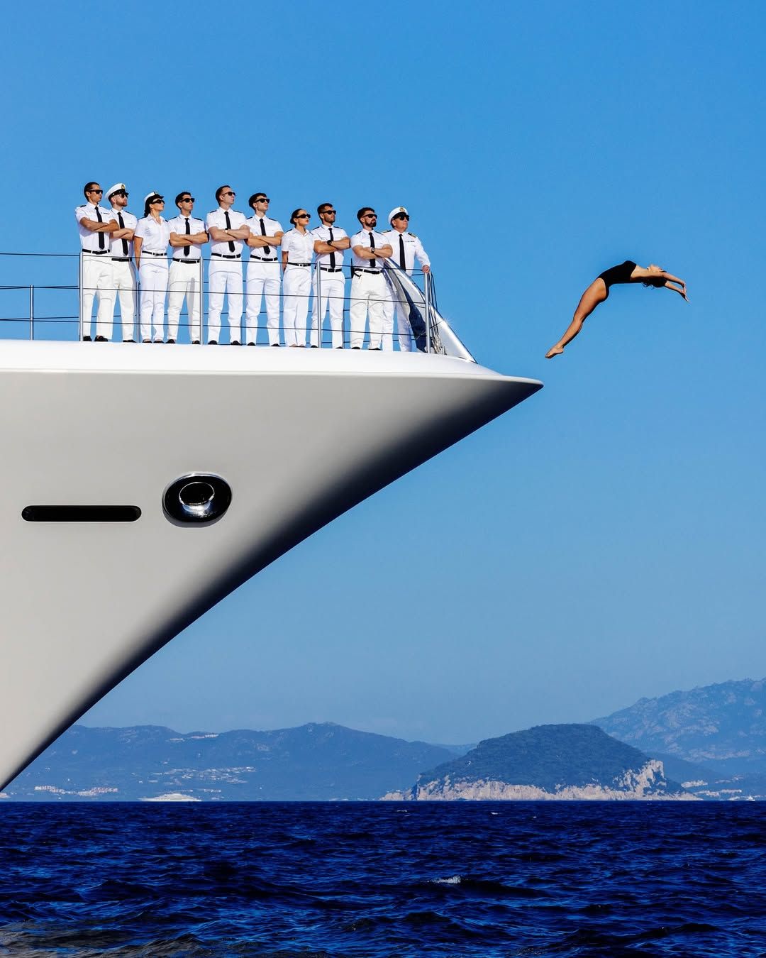 Instagram post: Unexpected diver and yacht-bow composition