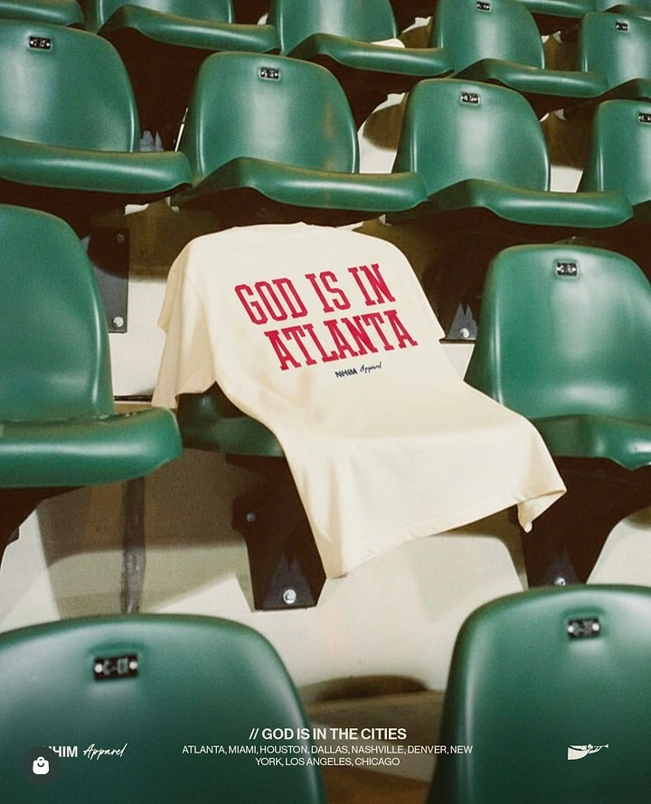 Print-on-Demand & Merch creative ad: Cream graphic tee draped over green stadium seats