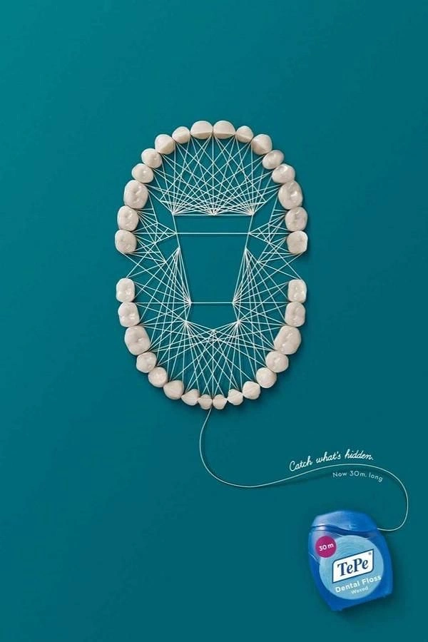 Dental creative ad: Teeth arch laced with floss string art forming a hidden shape