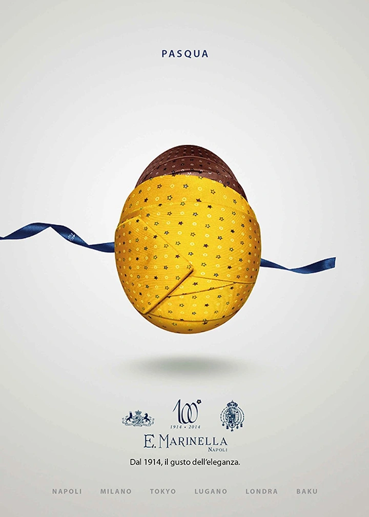 Easter creative ad: Egg wrapped in patterned silk ties floating with a navy ribbon