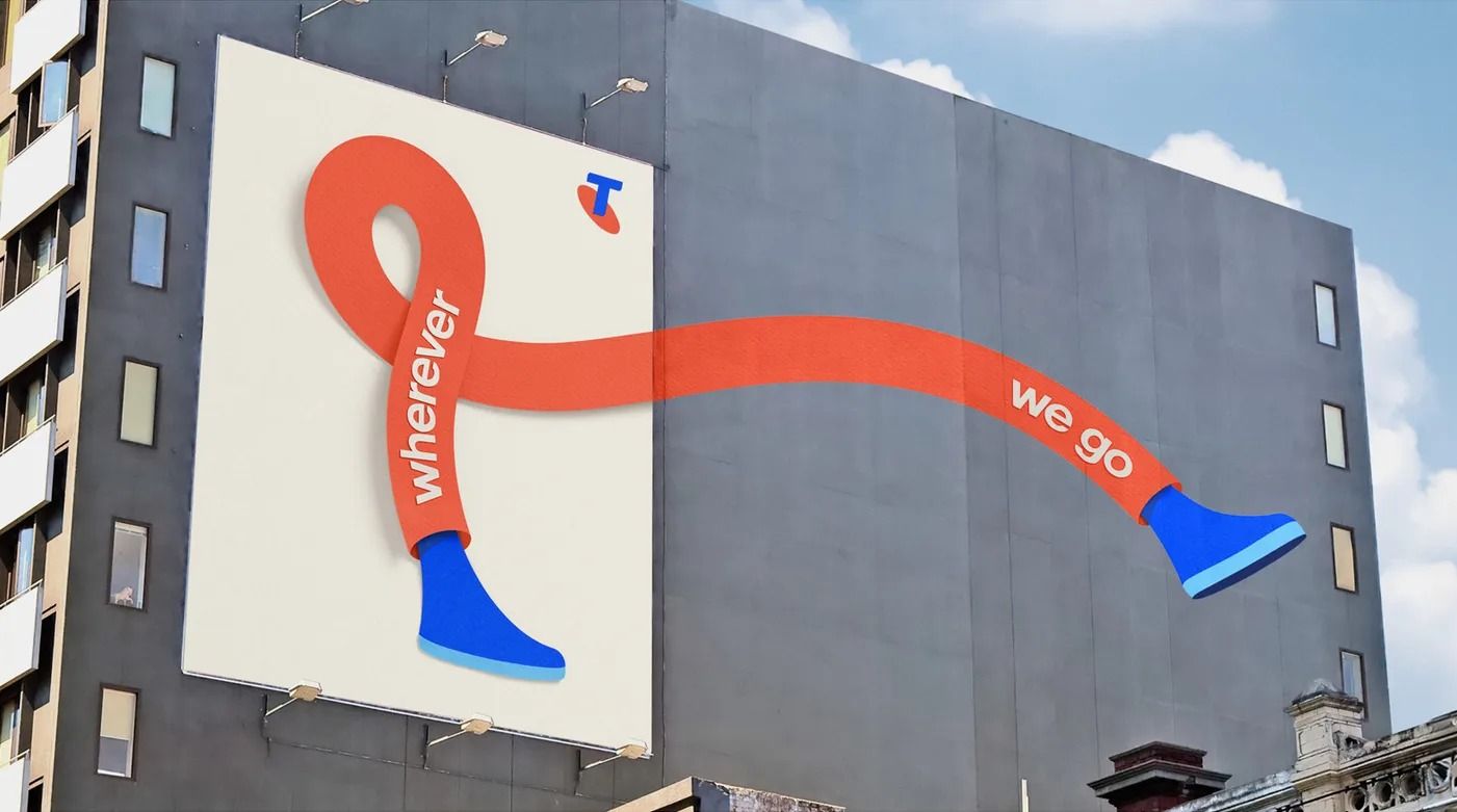 Banner: Orange ribbon with blue shoes stepping out of a billboard