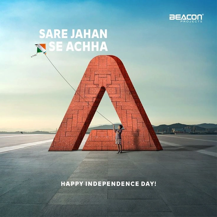 Independence Day creative ad: Child flying a tricolour kite beside a giant red-brick letter A sculpture
