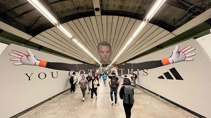 Activewear & Gym Wear creative ad: Goalkeeper's face on tunnel ceiling with arms stretching along both walls
