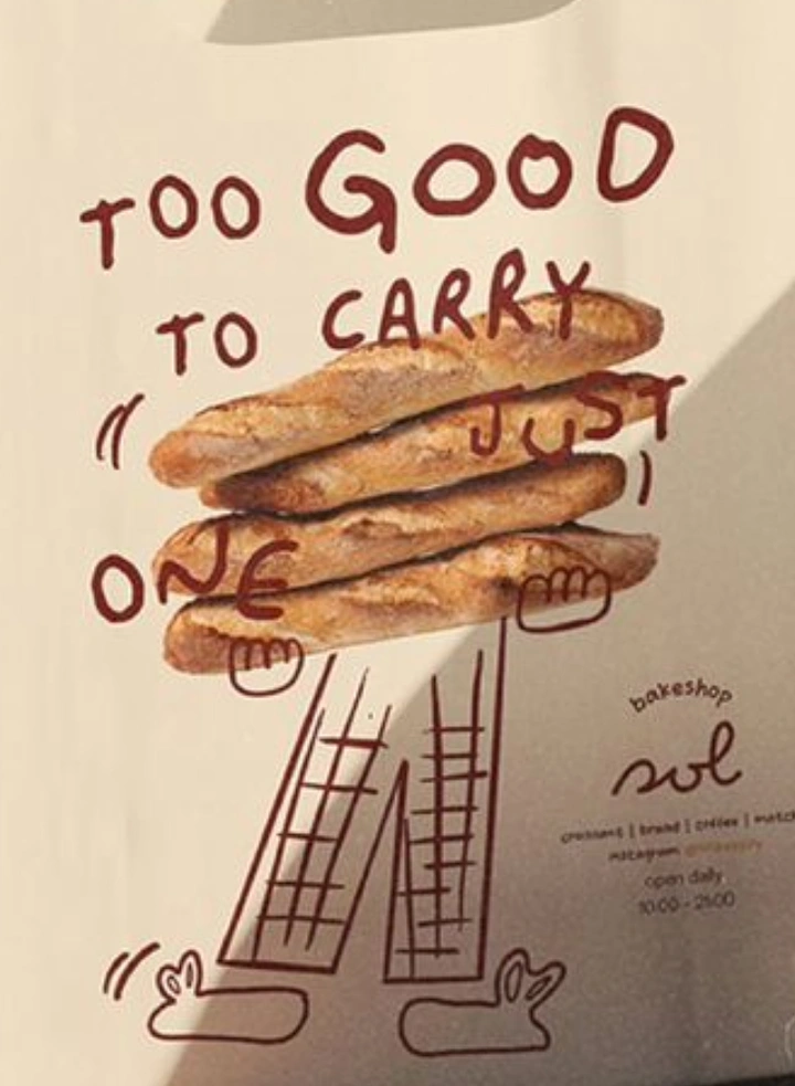 Coffee Shops creative ad: Stack of baguettes with doodled arms and legs