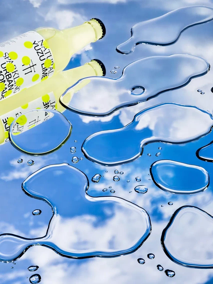 Packaged Drinking Water creative ad: Bottles echoed by flowing water shapes