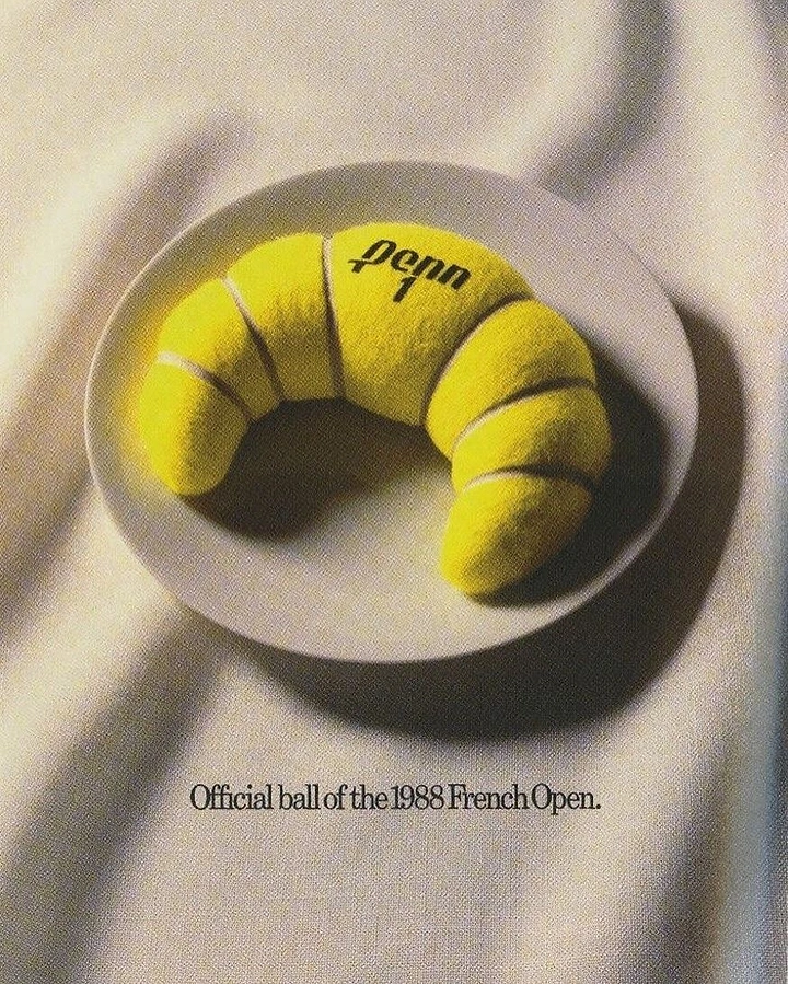 Sports Goods Stores creative ad: Croissant made of yellow tennis-ball felt on a plate