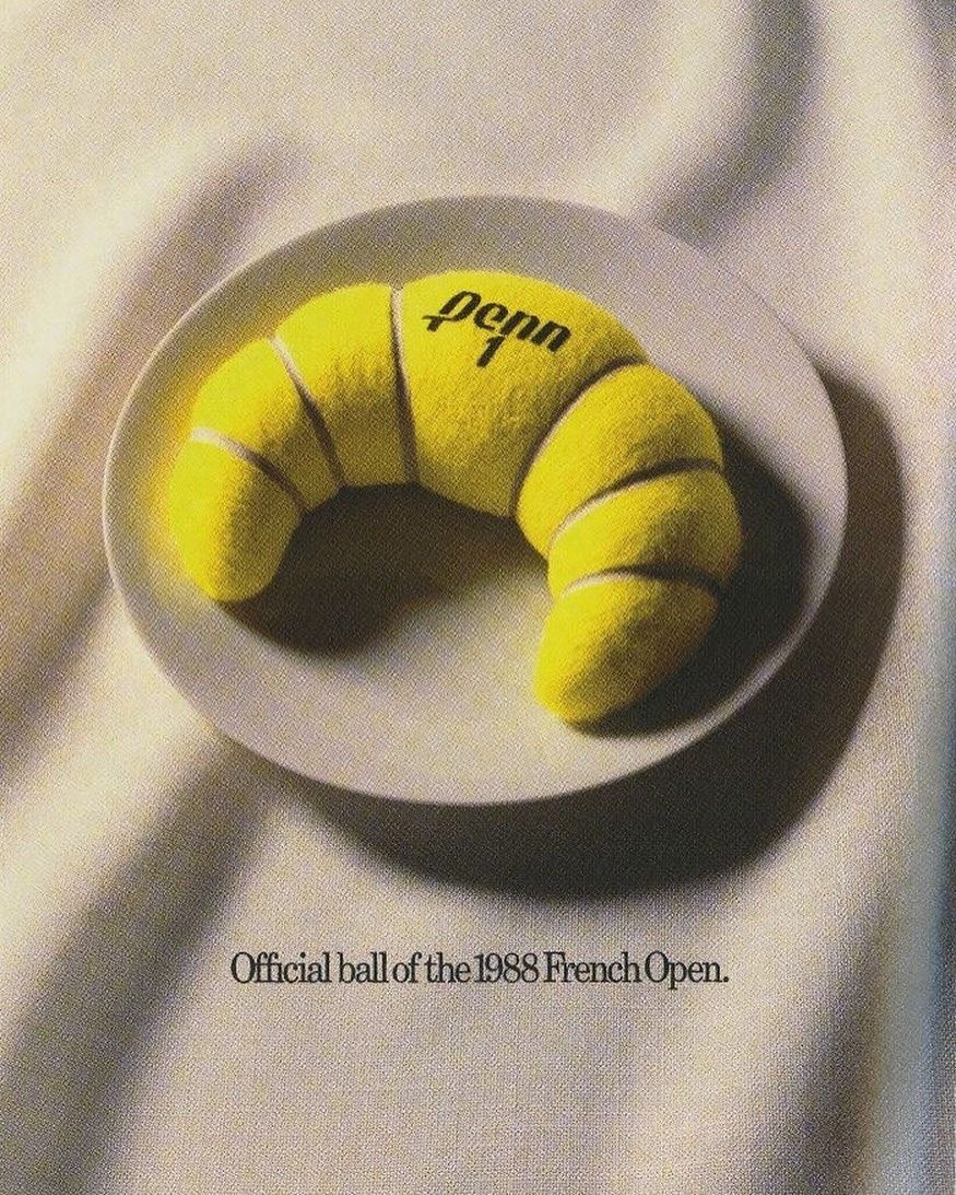 Poster: Croissant made of yellow tennis-ball felt on a plate