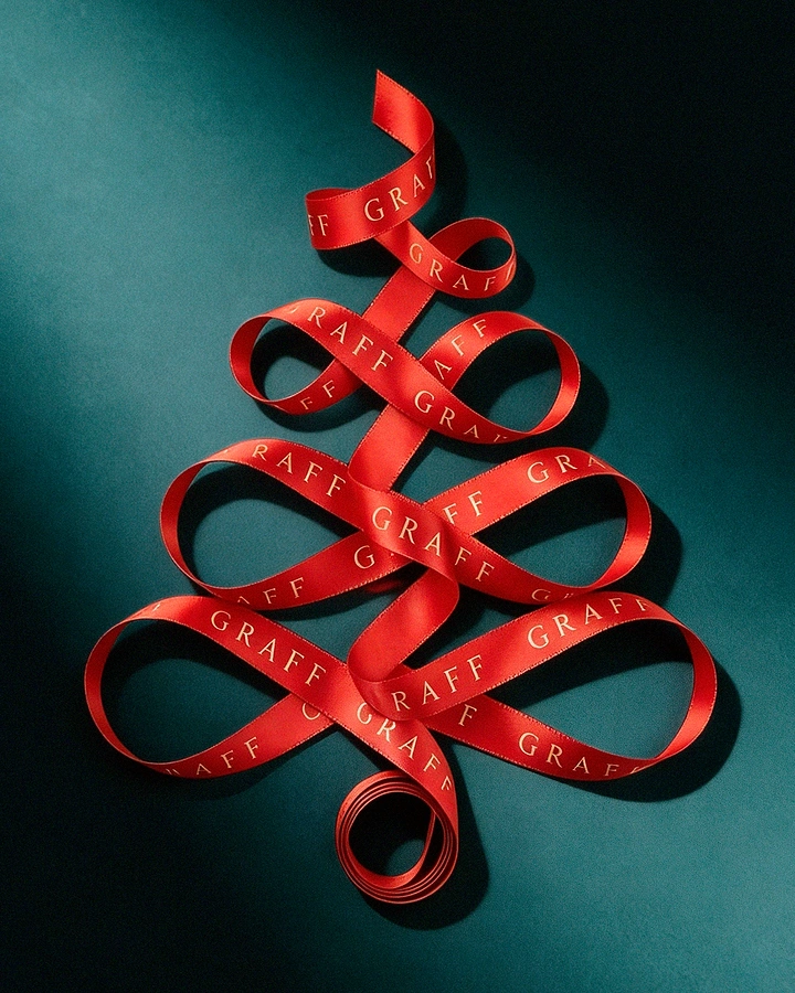 Jewellery creative ad: Branded red satin ribbon looped into a Christmas tree