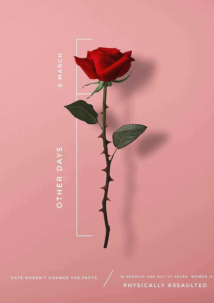 Women's Day creative ad: Single red rose with a long thorny stem